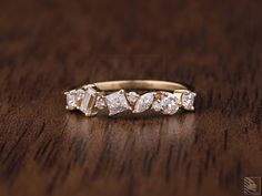 a diamond ring sitting on top of a wooden table