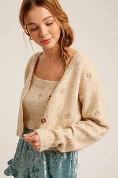 -Available in Sage & Oatmeal -Cami and cardigan sweater set -Cozy fur knit sweater -Flower embroidered -Crop length cami -Button down crop cardi -Content: 50% Nylon 25% Polyester 25% Acrylic -Imported -Model is 5' 10" 32-26-35 and wearing a size Small Styles For Hourglass Shape, Character Clothes Ideas, Cute Clothes Aesthetic, Cropped Cardigan Outfit, Icons Taylor Swift, Kibbe Romantic, Knits Sweaters, Flower Cardigan, Fitted Tops