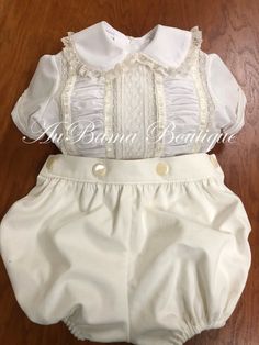 Beautiful button-on bubble with exquisite detail Shown in White shirt w ecru laces; ivory shorts Can make in most any colors Elegant Buttoned Shorts For Spring, Elegant Fitted Cream Shorts, Elegant Fitted Shorts With Button Closure, White Fitted Buttoned Shorts, Fitted White Shorts With Buttons, White Dress Outfit, Heirloom Dresses, White Shirt, Boy's Clothing