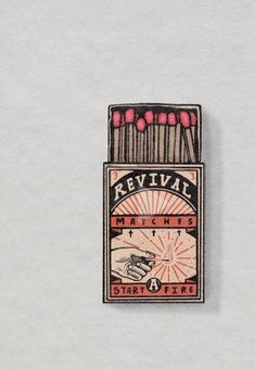 a matchbox pin with matches in it