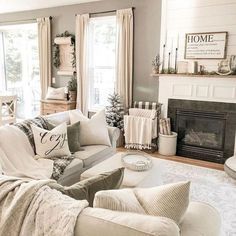 a living room filled with furniture and a fire place