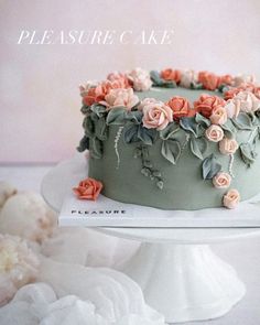 there is a cake decorated with flowers on the top and bottom, sitting on a plate