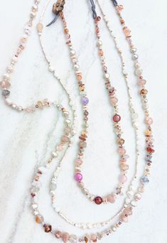 Three beautiful necklaces to choose from. First, this bold chunky necklace stocked with a variety of shapes, sizes, textures, and finishes. Opals, crystal, glass, and pearls. Elegant and and natural...pinks, fushia, purple, browns, oranges, soft mustards, maroons, ruby, rose, salmon, a beautiful sangria. Opals, Moonstone, pink shell, Aventurine, several Agates and Jaspers, Pearls, Sunstone, Ruby, Strawberry and Rose Quartz, Citrine, recycled Czech beads, Howlite, and more mixed in with delicate Ruby Quartz, Jello Mold, Jello Molds, Peach Moonstone, Fresh Water Pearl, Ruby Rose, Chunky Necklace, Czech Beads, Favorite Things Gift