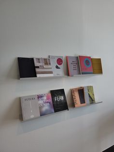 several books are hanging on the wall