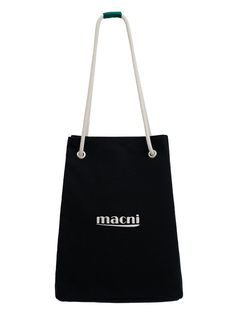 a black and white bag with the word macni printed on it's side