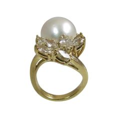 18K yellow gold, South Sea Pearl and diamond ring, prong set with seven marquise diamonds weighing 1.71cts, G-H color, VS clarity, and channel set with eight baguette diamonds weighing .30cts, G-H color, VS clarity and one pear shape South Sea Pearl measuring 16mm x 13mm. Finger size 6. May be sized. Retail $17,500 Yellow Gold Diamond Ring, Pearl And Diamond Ring, Baguette Diamonds, Sea Pearl, South Sea Pearls, Sea Pearls, Marquise Diamond, Channel Set, Pearl Diamond