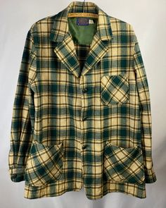 "1970s - 1980s Pendleton Three-Pocket Plaid Shacket... Shades of green, tan, brown, and white. Good shape, but not perfect-- a few pin holes and slight stains... please see pictures. Size: M Length (top of collar to bottom): 31\" Width (pit to pit): 22\" N O T E || As with most vintage items, they will have signs of wear. We do our best to note any noticeable flaws either in the descriptions or the photos. Please message us with any questions about the conditions of items before purchasing. All Green Collared Outerwear With Patch Pockets, Green Collared Outerwear With Welt Pockets, Green Top With Patch Pockets For Fall, Green Fall Tops With Flap Pockets, Green Tops With Flap Pockets For Fall, Green Long Sleeve Tops With Patch Pockets, Retro Long Sleeve Top With Pockets, Green Top With Lapel Collar And Pockets, Green Tops With Lapel Collar And Pockets