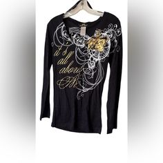 Long Sleeve Black Baby Phat Top Featuring V-Neck “It’s All About Me” Graphic In Gold As Well A Crown On The Shoulder White Graphics All Around Them Both Sheer & Solid Like Pattern Throughout The Entire Shirt! Made With 60% Cotton 40% Polyester New Without Tags No Call Outs Size-Small Approx Measurements Shoulder To Shoulder - 16.5“ W Chest (Pit To Pit)-16“ Arm- 5“W 23“L Full Length-27“ Baby Phat Runway, Baby Phat Shirt, Baby Phat Sunglasses, Baby Phat, Black Babies, Fancy Dresses, Full Length, Long Sleeve Tees, Long Sleeve Tops