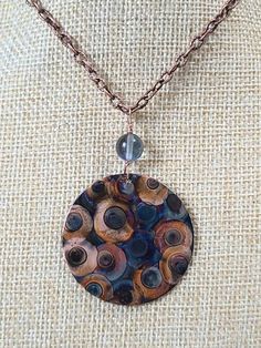 "This necklace is made with copper and fire only! I make it by painting patterns onto copper with a micro torch, and as the copper heats and cools it turns different colors naturally! The copper circle 1 1/2\" and is attached to a 30\" chunky copper chain. Definitely a one of a kind piece! These are custom made per order, so please remember - I have little control of what colors happen - your piece may not look exactly like the picture - it may be similiar, it may be more vibrant, it may be a di Multicolor Round Copper Jewelry, Unique Multicolor Copper Necklace, Multicolor Copper Necklace, Artsy Brown Copper Jewelry, Artistic Brown Copper Jewelry, Handmade Rust-colored Copper Necklaces, Handmade Rust Copper Necklaces, Artsy Hand Forged Copper Jewelry, Artisan Nickel-free Copper Necklaces