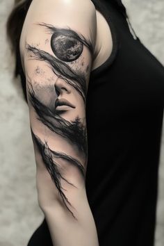 a woman's arm with black and grey ink on it, showing her face