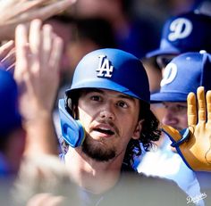 the los angeles dodgers players are applauding for their team's first pitch