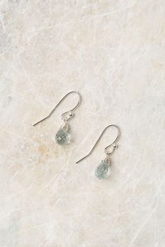 Experience the beauty of these exquisite earrings featuring a sterling silver wire wrapped aquamarine birthstone. Perfect for those born in March! Sterling Silver (lead and nickel free) Aquamarine On sterling silver ear wires We hand select our natural materials, thus there may be slight variations in color and/or size that will not detract from the overall aesthetic Our unique handcrafted designer jewelry for women is made in America, with each design created individually in our personal design Birth Flower March, Floyd Va, Born In March, Silver Gold Earrings, Silver Gold Necklace, Aquamarine Birthstone, Aquamarine Earrings, Sterling Silver Wire Wrap, Garnet Earrings