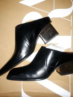 NWT $129 ZARA BLACK LEATHER SQUARE TOE CLOG SILVER HEEL MULES 1204/610 SZ 9 BLOG FAV!. Shipped with USPS Priority Mail. *NOTE PLEASE ASK ALL QUESTIONS AS I NO LONGER ACCEPT RETURNS ANYMORE ALSO PLEASE KNOW YOUR SIZE OR RESEARCH IN CERTAIN BRANDS AS I AM NOT RESPONSIBLE FOR SIZING ISSUES Office Slip-on Mules With Sculpted Heel, Pointed Toe Mules With Stacked Heel For Work, Workwear Mules With Reinforced Heel And Pointed Toe, Modern Pointed Toe Mules With Stacked Heel, Modern Closed Toe Mules With Sculpted Heel, Pointed Toe Mules With Wooden Heel, Office Closed Toe Mules With Sculpted Heel, Closed Toe Mules For Evening In Fall, Closed Toe Mules With Wrapped Heel For Fall