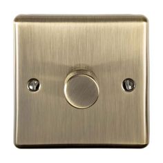 an old style light switch with two knobs on the front and one button on the back