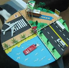 a table that has some cars and planes on it