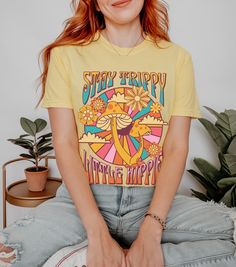 Stay trippy little hippie! Show your free spirited side with this awesome mushroom tee printed on a comfort color shirt. Order a size or two up for that trendy oversized shirt look!  Professionally printed t-shirts, perfect for anyone looking for comfortable and stylish everyday wear. Our t-shirts are made from 100% cotton (excluding heather colors) and feature a comfortable, relaxed fit that's perfect for any occasion. With a variety of trendy designs to choose from, there's a t-shirt for everyone in our collection. Features: Professionally printed designs for a high-quality finish Comfortable, relaxed fit for all-day comfort Made from 100% cotton (excluding heather colors and tank tops) Unisex fit that's perfect for everyone Size chart available in the images for accurate sizing Processi Groovy Mushroom, Stay Trippy Little Hippie, Festival Shirt, Hippie Shirt, Festival Shirts, Shirt Stays, Hippie Festival, Comfort Color, Retro Shirts