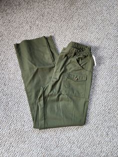 Like new, one flaw on back waistband, see photo.  Raw hem, unhemmed  34x34 on tag Waist 30 to 36, elasticized  Inseam 34 Hip 42 Mens Uniform, Grunge Ideas, Kelly Green Sweater, Girls Matching Dresses, Men's Uniform, Taffeta Skirt, Blazer For Boys, Uniform Pants, Boy Scouts Of America