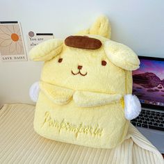 This Pompompurin backpack is more than just a carry item; it’s a nod to all things cute and playful in the kawaii culture. Its plush exterior promises comfort and adds a dash of charm to any ensemble, making it an ideal pick for those who adore cute anime bags. Designed to delight fans of all ages, this pompompurin plush backpack is your go-to for a mix of fun and functionality, ensuring you or your little one shines in any crowd. Dive into the cute world of kawaii with the Pompompurin Plush Bac Pompompurin Backpack, Big Squishies, Anime Bag, Plush Bags, Plush Backpack, Unique Kids, Bag Stand, All Things Cute, Kids Backpacks