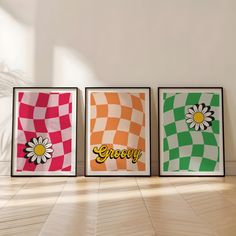 three framed posters with the word grooy on them in front of a white wall