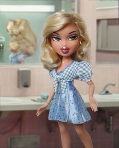 a barbie doll standing in front of a bathroom mirror