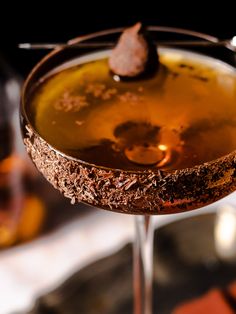 a close up of a drink in a glass on a table