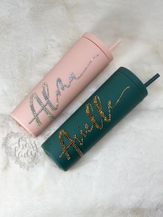 two personalized travel mugs sitting next to each other on a white furnishing