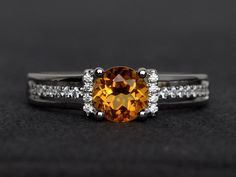 Welcome to my shop, you can find many beautiful gemstone jewelry here, and you also can ask for customized service. Main Stone: citrine, round cut 6X6mm, 0.80 carats Accent Stones: cz Metal: 925 sterling silver plated with rhodium. I also can provide metal options such as 14k solid yellow/white/rose goldSetting: prong setting If you want to know more rings please go to my shop home: https://www.etsy.com/shop/XCjewelryStudio?ref=hdr_shop_menuIt's a perfect gift for the person who was born in Nove Orange Topaz Round Ring For Anniversary, Orange Topaz Anniversary Ring, Orange Topaz Round Ring, Elegant Orange Topaz Round Ring, Yellow Round Topaz Ring With Prong Setting, Yellow Topaz Promise Ring, Round Cut, Topaz Citrine Ring With Center Stone, Elegant Citrine Birthstone Ring, Formal Citrine Birthstone Ring