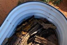 the inside of a bucket filled with firewood