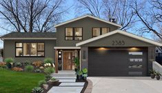 this is a rendering of a two story house with an attached garage and front porch