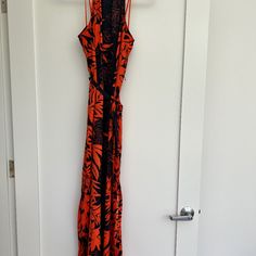 Donna Morgan Sleeveless Maxi Dress Size 6 Never Worn Dark Navy And Orange Sleeveless Maxi Dress With Orange Cord Halter Slits Both Sides And A Tie At The Waist Chic Orange Halter Neck Sleeveless Dress, Orange Halter Neck Sleeveless Dress For Vacation, Orange Sleeveless Maxi Dress For Beach, Red Sleeveless Maxi Dress With Side Slits, Sleeveless Orange Maxi Dress With Floral Print, Orange Sleeveless Maxi Dress With Floral Print, Orange Sleeveless Maxi Dress For Vacation, Orange Halter Neck Summer Maxi Dress, Sleeveless Sundress With Side Slits