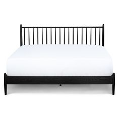 a black bed frame with white sheets and pillows on it, against a white background