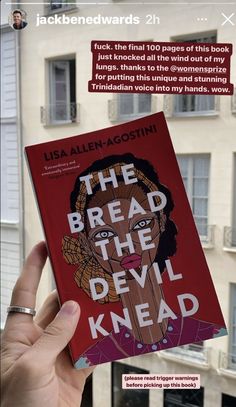 a person holding up a book in front of a building with the title, the bread the devil knead