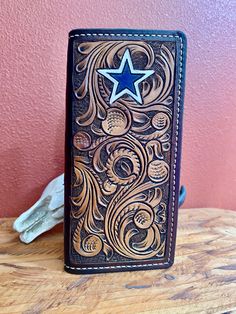 a wallet with a star on it sitting on a table