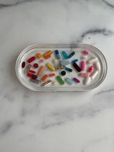 "Super fun art piece handmade resin tray.  Chill Pill tray is 7\" x 3.75\" at the outside dimensions. The tray has a .25\" rim on it so it makes the interior dimensions 6.5\" x 3.25\". And the whole thing is about .66\" tall. Our art resin is BPA free and food safe and can be used on cutting boards, tumblers, and other kitchen items. High quality, non-toxic, art resin with zero VOCs and odor free is always used. All epoxy resin may yellow over time, to avoid this please limit direct sunlight exp Pill Resin Art, Pill Ashtray, Pill Art, Toxic Art, Resin Home Decor, Colorful Room Decor, Resin Tray, Chill Pill, Interior Dimensions