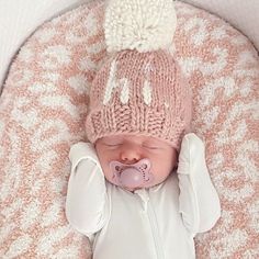 What a cute way to greet the world! This beanie is hand knit in cozy Rosy pink hued yarn with the word 'hi.' in natural colored yarn. Topped with a natural yarn pom pom, this looks great with everything and is a fun gender neutral baby gift.• 100% Acrylic• Cold handwash• Hand knit in China Girls Beanie Hats, Knitted Baby Beanies, Girls Knit Hat, Pink Baby Blanket, Neutral Baby Gifts, Thoughtful Baby Shower Gifts, Gender Neutral Baby Gifts, Hand Knit Blanket, Newborn Hats