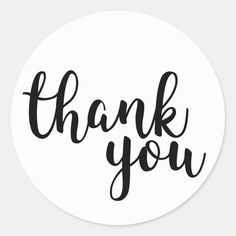 the words thank you in black ink on a white round sticker that says, thank you