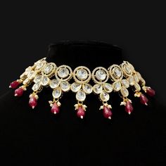 This modern yet sophisticated statement necklace and earring set is an ideal addition to your designer accessories. Crafted while keeping Indian aesthetic in mind in a beautiful gold finish, this stunning set is adorned with kundan dark red beads for an eye-catching effect. The earrings measure 5.4 cm in length and can be worn either together or individually. The Jordyn Kundan Necklace Set provides a glamorous touch to any look. Our in-house stylists have personally designed this set. It surely Beige Jewelry, Peach Jewelry, Oxidized Silver Earrings, Orange Jewelry, Australia Melbourne, German Silver Jewelry, Multicolor Jewelry, Gray Jewelry