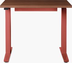 a wooden table with red legs and a brown top