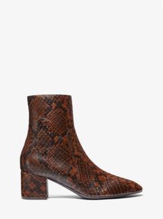 Crafted from python-embossed leather, the Gloria is a contemporary spin on the classic ankle boot. The mid-rise block heel offsets the elegantly pointed toe, while the minimal design ensures endless styling options. Style yours with plush cashmere dresses or wool miniskirts for an extra sophisticated feel. Chic Snake Print Boots With Block Heel, Elegant Heeled Boots With Snake Print And Pointed Toe, Elegant Snake Print Heeled Boots With Pointed Toe, Fall Leather Heeled Boots With Snake Print, Leather Heeled Boots With Snake Print For Fall, Cashmere Dress, Leather Boot, Minimal Design, Embossed Leather