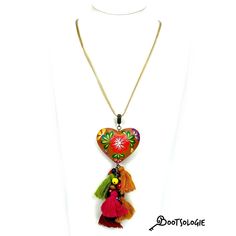 Hand painted heart Necklace. Hand painted by artisans in Chiapas Mexico, this lovely necklaces are decorated with wooden hearts and many bead strands to give the ethnic a more modern look. Adjustable height so you can wear it close to the neck or way below. Dimesions: 22 inches long. Handmade Heart-shaped Jewelry For Festivals, Adjustable Bohemian Heart Pendant Jewelry, Traditional Multicolor Heart Beads Necklace, Handmade Heart Pendant Necklace, Bohemian Multicolor Heart Beads Necklace, Traditional Hand Painted Multicolor Necklaces, Traditional Multicolor Hand-painted Necklace, Traditional Multicolor Hand Painted Necklace, Bohemian Heart Charm Necklace For Festivals