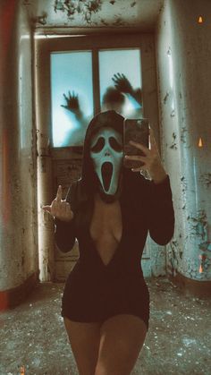 a woman wearing a mask taking a selfie