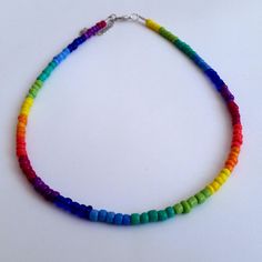 Colorful Rainbow Seed Beads Necklace This is a dainty beaded necklace, made with 9 different colors of pretty glass seed beads. It is on a beading wire and it has and extender for additional length. Let me know if you have any questions :) Happy shopping!! Adjustable Rainbow Beaded Necklace, Rainbow Round Beaded Necklaces With Tiny Beads, Rainbow Beaded Necklaces For Jewelry Making, Rainbow Heart Beads For Jewelry Making, Rainbow Spacer Beads For Jewelry Making, Rainbow Heart Shaped Beads, Rainbow Heart-shaped Beads, Rainbow Beaded Necklace With Heart Beads, Rainbow Necklaces With Tiny Round Beads