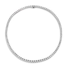 Experience elegance and class with this 18kt White Gold Diamond Tennis Necklace from H&H Jewels. Showcasing 105 diamonds artfully arranged in a straight line, you'll be sure to turn heads. 16 inch length. White Gold Diamond Tennis Necklace 18kt. White Gold Prong set diamonds Diamonds: 19.87ct I/J VS1 (EX,EX) Straight Line 16" Necklace H&H Jewels SKU: 21008 Diamond Tennis Necklace With Pave Setting For Formal Occasions, Formal Diamond Tennis Necklace With Pave Setting, Formal Diamond White Tennis Necklace With Pave Setting, Formal Round Tennis Necklace With Pave Setting, Classic Formal Tennis Necklace With Pave Setting, Classic Round Tennis Necklace With Pave Setting, Classic Diamond Necklace With Pave Setting For Formal Occasions, Classic Formal Diamond Necklace With Pave Setting, Classic Tennis Necklace With Pave Setting For Anniversary