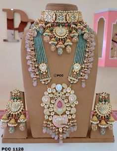 an elaborate necklace and earring set on display