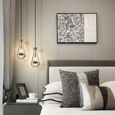 a bed with white sheets and pillows next to two hanging lights above the headboard