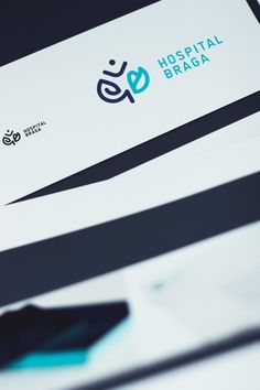 the hospital braca logo is displayed on a white and black business card with blue accents