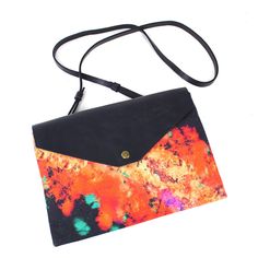 In collaboration with British print designer Samantha Warren, this is the ideal clutch bag to complete your look. It's the perfect size to store your favorite items and can easily be slung over your shoulder, crossbody or tucked under your arm in style. This clutch has a stylish Navy flap which is secured with a copper magnetic closure. It also benefits from a zipped pocket at the back, perfect for storing your cards and loose change. The design of the bag is simple yet elegant and executed with Trendy Clutch With Adjustable Strap As Gift, Trendy Clutch With Adjustable Strap For Gift, Daily Use Crossbody Clutch With Magnetic Closure, Trendy Rectangular Shoulder Bag With Laptop Sleeve, Laptop Sleeve Crossbody Shoulder Bag For On-the-go, Crossbody Shoulder Bag With Laptop Sleeve For On-the-go, Travel Crossbody Clutch With Magnetic Closure, Chic Multicolor Clutch With Removable Pouch, Trendy Daily Use Clutch With Magnetic Closure