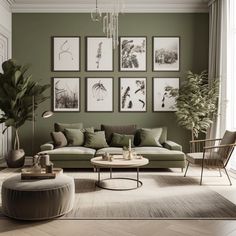 a living room with green walls and pictures on the wall above the couch, coffee table