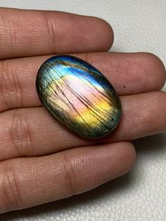 Great ~ Multi Purple Fire Labradorite Oval Shape Cabochon Size - 21.50x32x8 Mm. At Very Reasonable Price Gemstone For Making All Jewelry.!! Product Info : Gemstone : Labradorite Cut : Cabochon Size : 21.50x32x8 Mm. Weight : 52.30 Carat Shape : Oval Quantity : 1 Pcs.. Drilling Service Is Available at Free Cost. You can also contact us for bulk we have also huge quantity in all types gemstone even i accepted tiny bulk order, i listed only few beautiful labradorite and moonstone we have such a hub Unique Multicolor Oval Gemstones, Multicolor Oval Jewelry With Natural Inclusions, Oval Natural Stones For Jewelry Making, Oval Gemstone Beads And Cabochons For Gifts, Handmade Oval Cabochons For Gifts, Purple Fire, Bulk Order, Oval Shape, Turquoise Ring