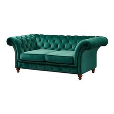 a green velvet chesterfield sofa with wooden legs and buttons on the armrests, in front of a white background